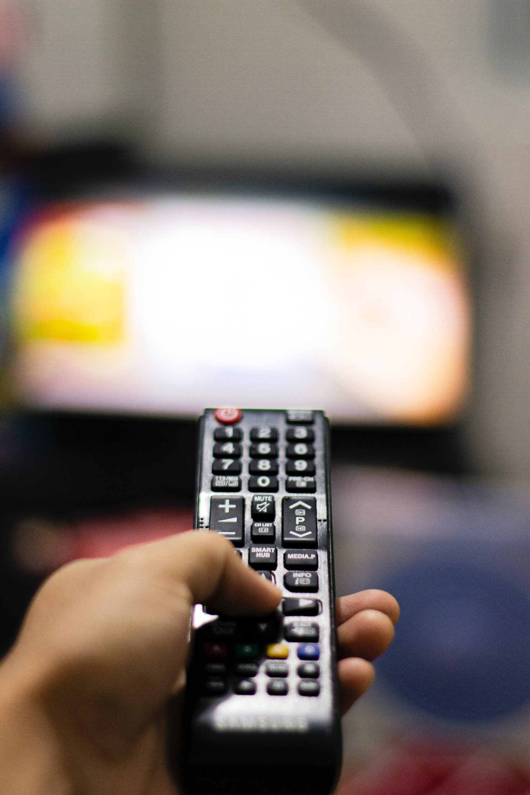 hand holding a tv remote