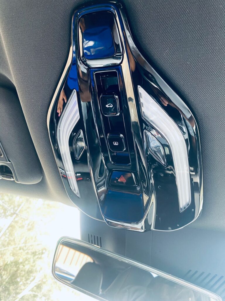 Located above the rearview mirror, these control notches on the Beijing X55 Plus are uniquely position to access the sunroof features.