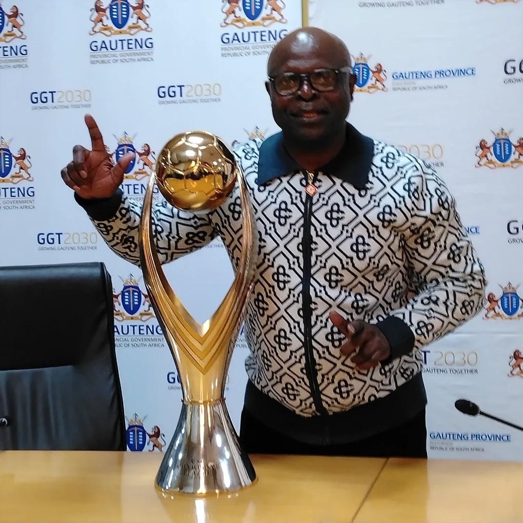 Mamelodi Sundowns Legend, Daniel Mambush Mudau poses with the team's CAF Champions League trophy at the Gauteng Legislature 