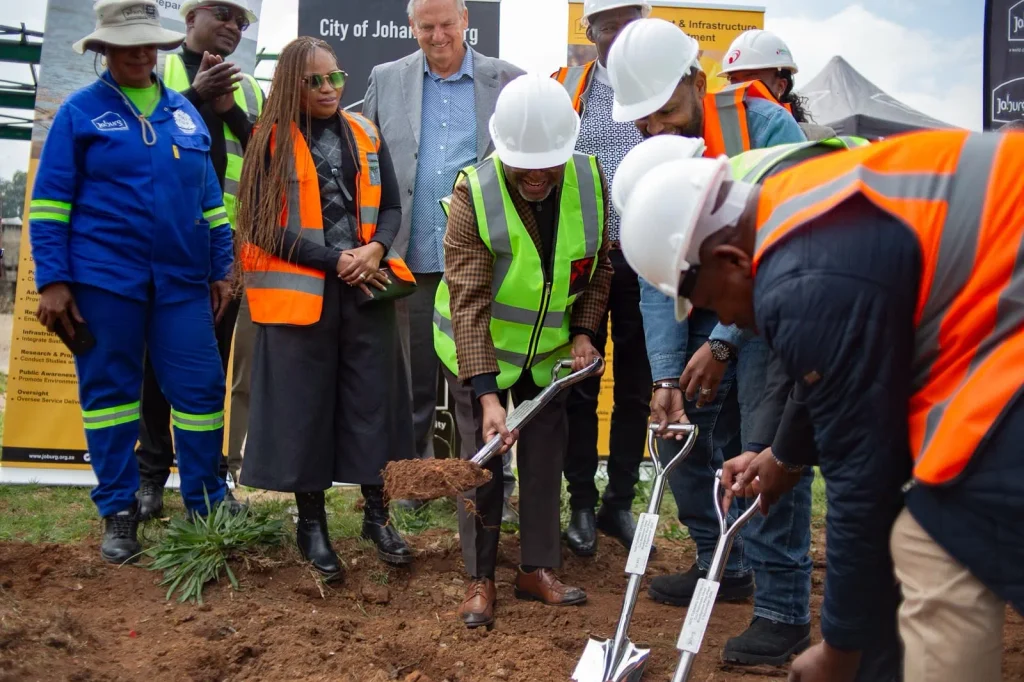 City of Joburg executive Mayor Dada Morero (in lime jacket holding soil on a spade) alongside the developers and councillors during the SOD-turning ceremony of the Biodigester project site. 